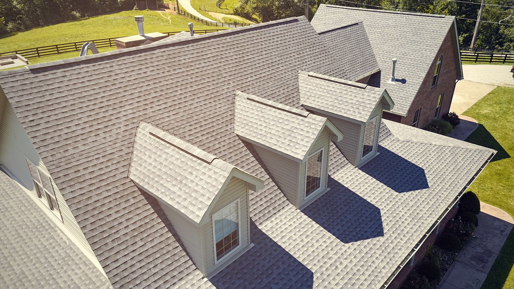 Aerial view of a completed Dynamo Roofing shingle roof in the Tri-State area